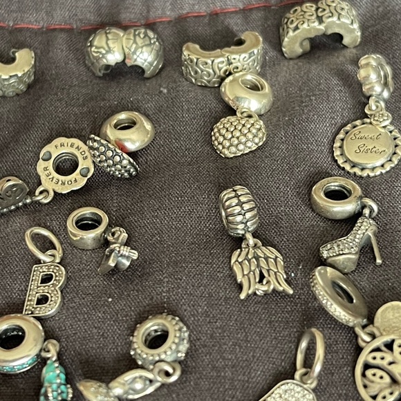 Lot of 26 Authentic Pandora charms.